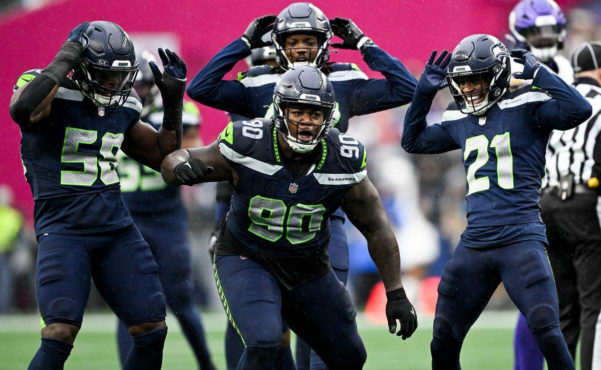 Seattle Seahawks defensive tackle Jarran Reed (90) reacts to a defensive stop against the Minnesota Vikings during the second quarter during the second quarter of the game at Lumen Field, on Sunday, Dec. 22, 2024, in Seattle, Wash.
