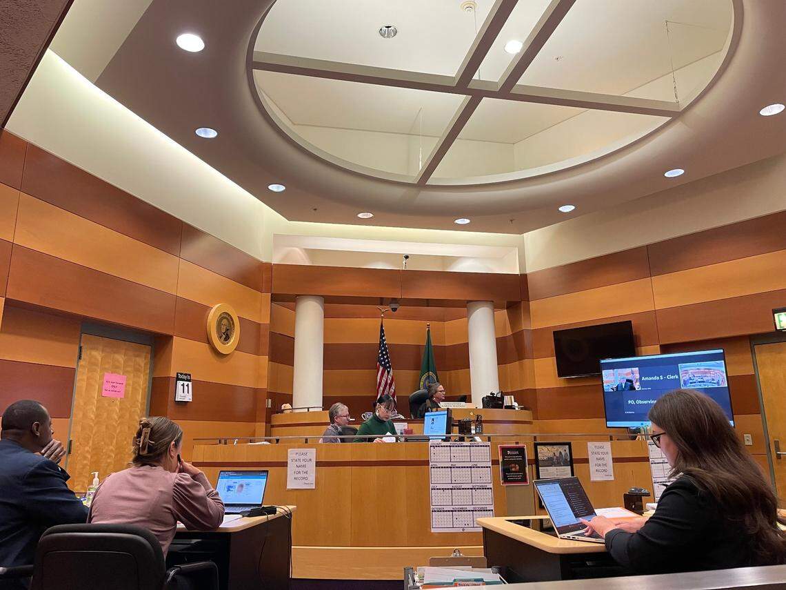 Pierce County Juvenile Court Commissioner Karen Watson (right of center) waits for two teenagers, both age 15, to appear for arraignment Thursday, Jan. 11, 2024, on charges of first-degree arson and second-degree burglary for a fire last week that badly damaged the long-closed Gault Middle School in Tacoma.
