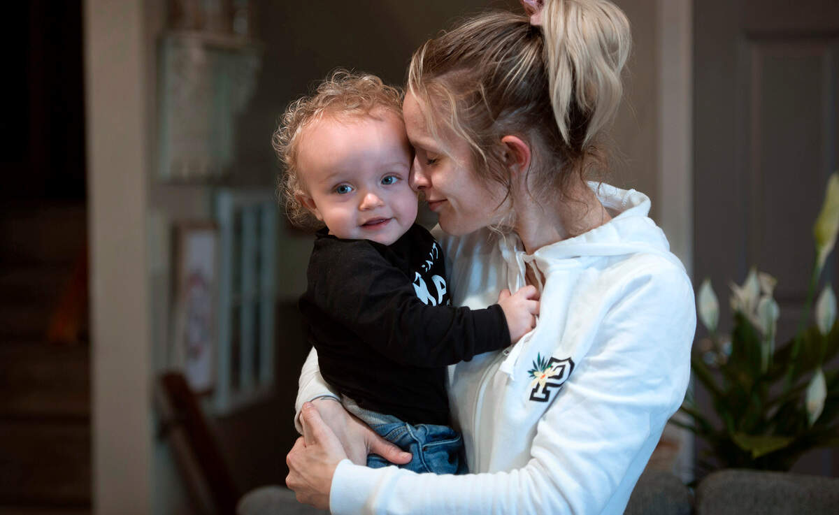 Hannah Potter snuggles with her 1-year-old son, Grayson, at her mother’s home in Puyallup, Washington, on Thursday, May 12, 2022. Grayson spent time in the Mary Bridge emergency room after drinking contaminated baby formula that has since been recalled. Finding formula was already a frustrating experience for Potter and other parents in the South Sound due to supply chain shortages.