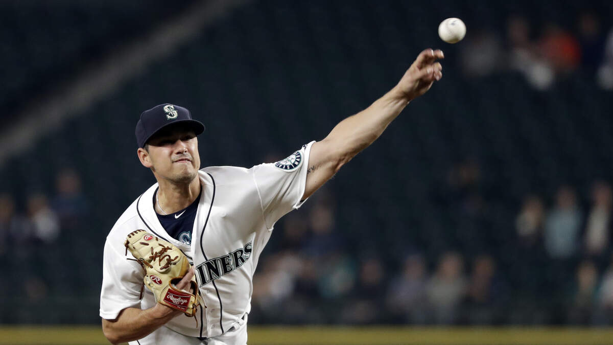 Seattle Mariners starting pitcher Marco Gonzales throws against the Texas Rangers in the first inning of a baseball game Thursday, Sept. 27, 2018, in Seattle. (AP Photo/Elaine Thompson)