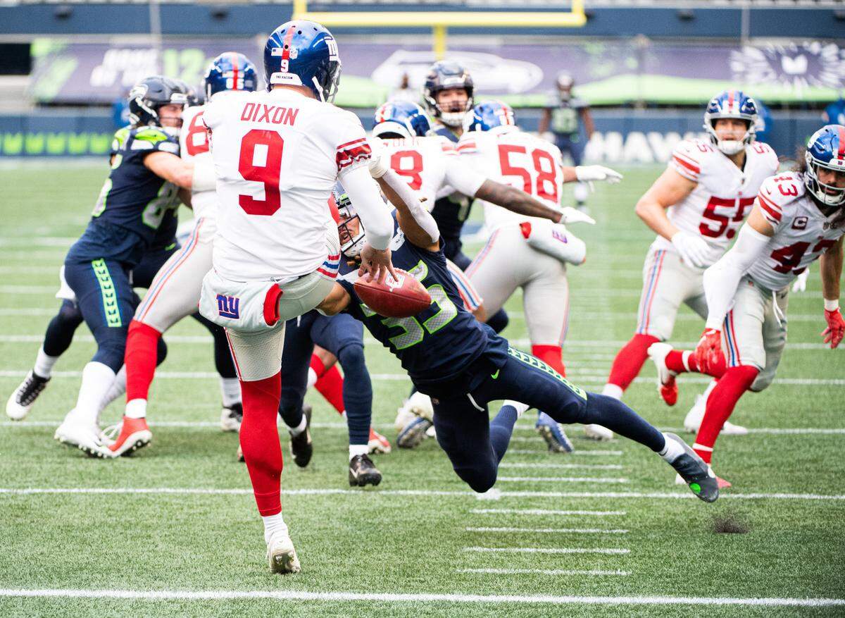 Seattle Seahawks defensive back Ryan Neal blocks a punt by New York Giants punter Riley Dixon which ends up being a faster during the second quarter. The Seattle Seahawks played the New York Giants in a NFL football game at Lumen Field in Seattle, Wash., on Sunday, Dec. 6, 2020.