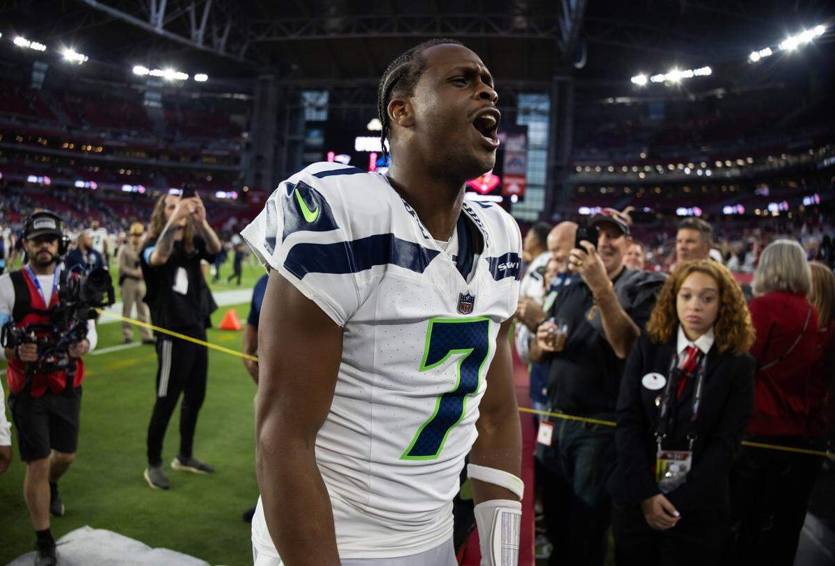 Seattle Seahawks quarterback Geno Smith (7) celebrates after defeating the Arizona Cardinals at State Farm Stadium. Mandatory Credit: Mark J. Rebilas-Imagn Images