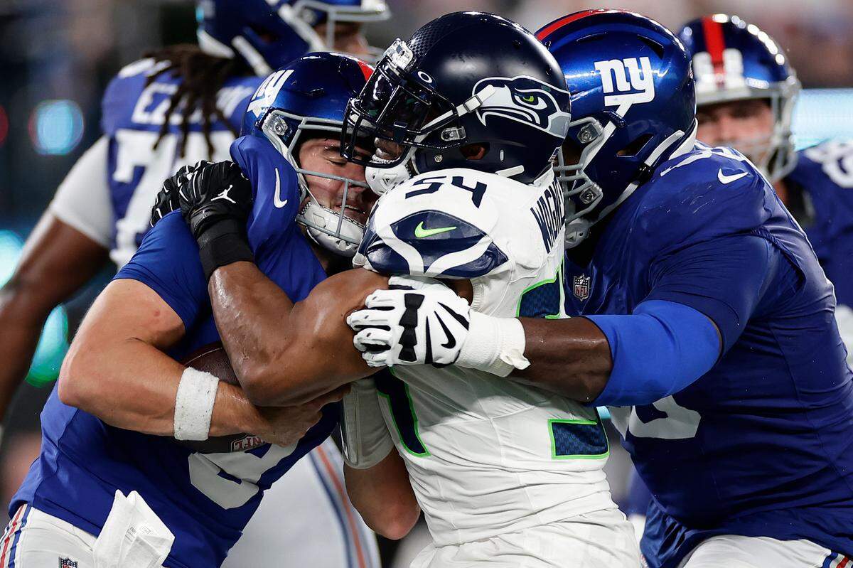 New York Giants quarterback Daniel Jones (8) is sacked by Seattle Seahawks linebacker Bobby Wagner (54) during the fourth quarter of an NFL football game, Monday, Oct. 2, 2023, in East Rutherford, N.J. (AP Photo/Adam Hunger)