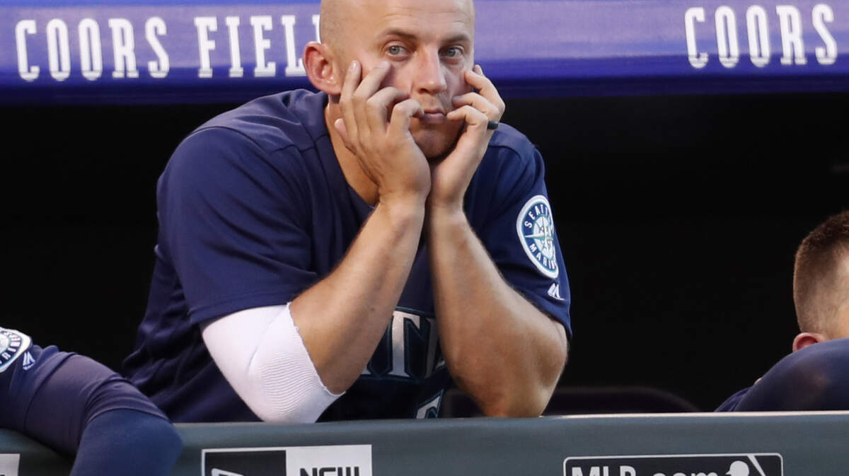 Seattle Mariners third baseman Kyle Seager looks on from the dugout as  his team bats against Colorado Rockies starting pitcher Jon Gray in the third inning of an interleague baseball game Saturday, July 14, 2018, in Denver. (AP Photo/David Zalubowski)