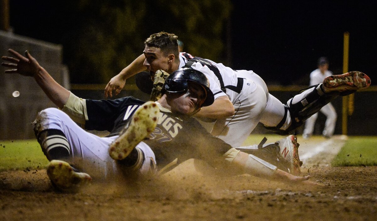 Camas catcher Grant Heiser tags out Puyallup’s Evan Scavatto at the plate in the fifth inning for the last out in the inning. Puyallup played Camas in a baseball game at Art Wright Field in Kent, Wash., on Saturday, May 11, 2019.