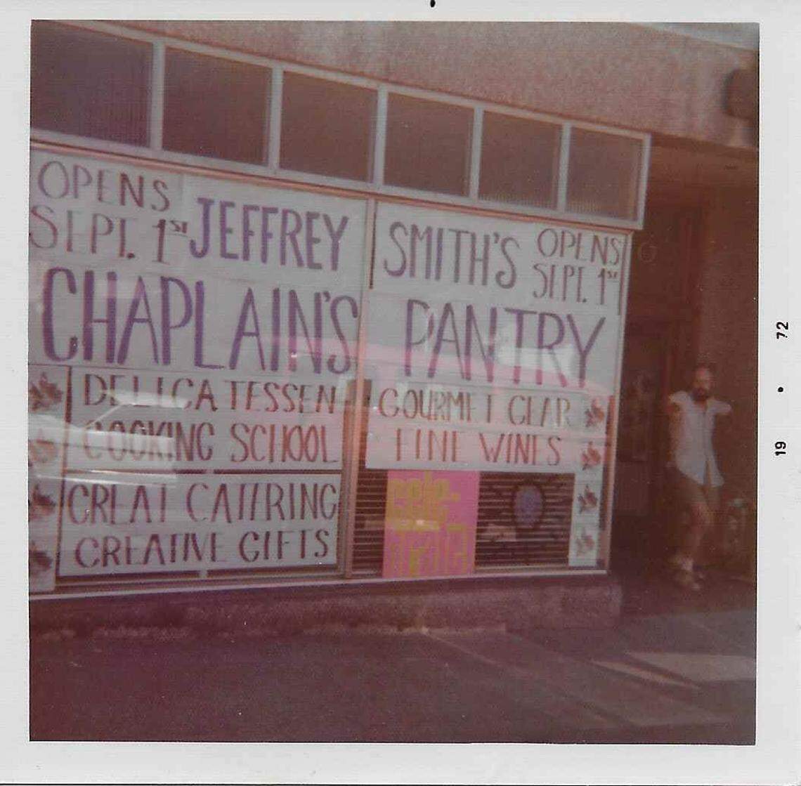 A man poses outside the exterior of the Chaplain’s Pantry, Jeff Smith’s store and cooking school that opened in 1972.