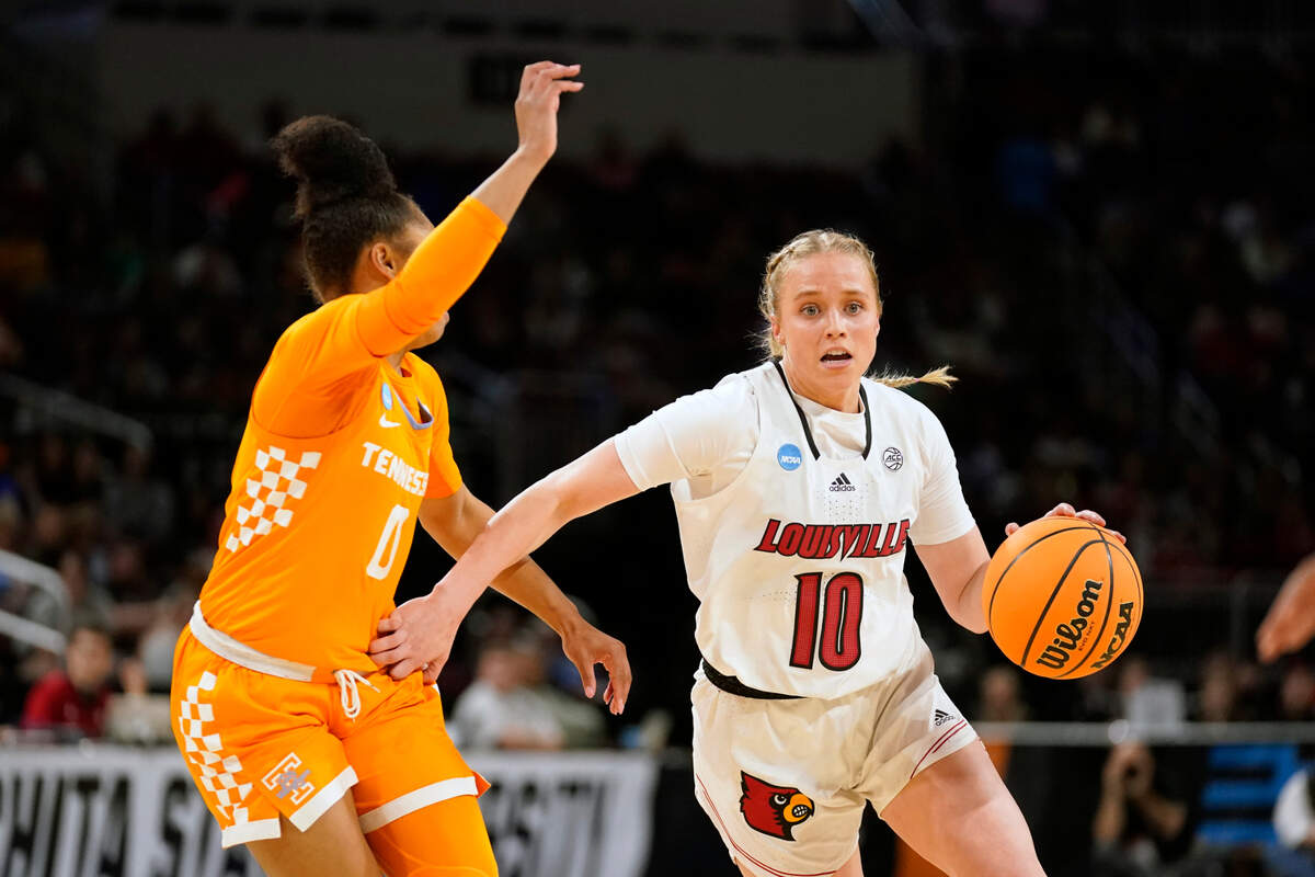 Louisville’s Hailey Van Lith (10) drives past Tennessee’s Brooklynn Miles (0) during the first half of a college basketball game in the Sweet 16 round of the NCAA women’s tournament Saturday, March 26, 2022, in Wichita, Kan. (AP Photo/Jeff Roberson)