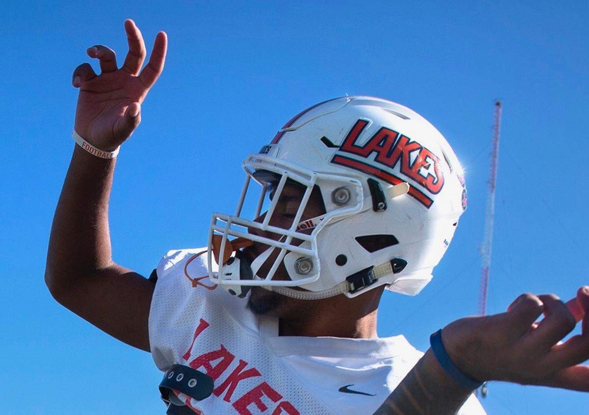 Lakes sophomore Devon Nofoa-Masoe (left) dances with teammate Jaydon McMillon during football practice at Lake High School in Lakewood on Oct. 1, 2019.