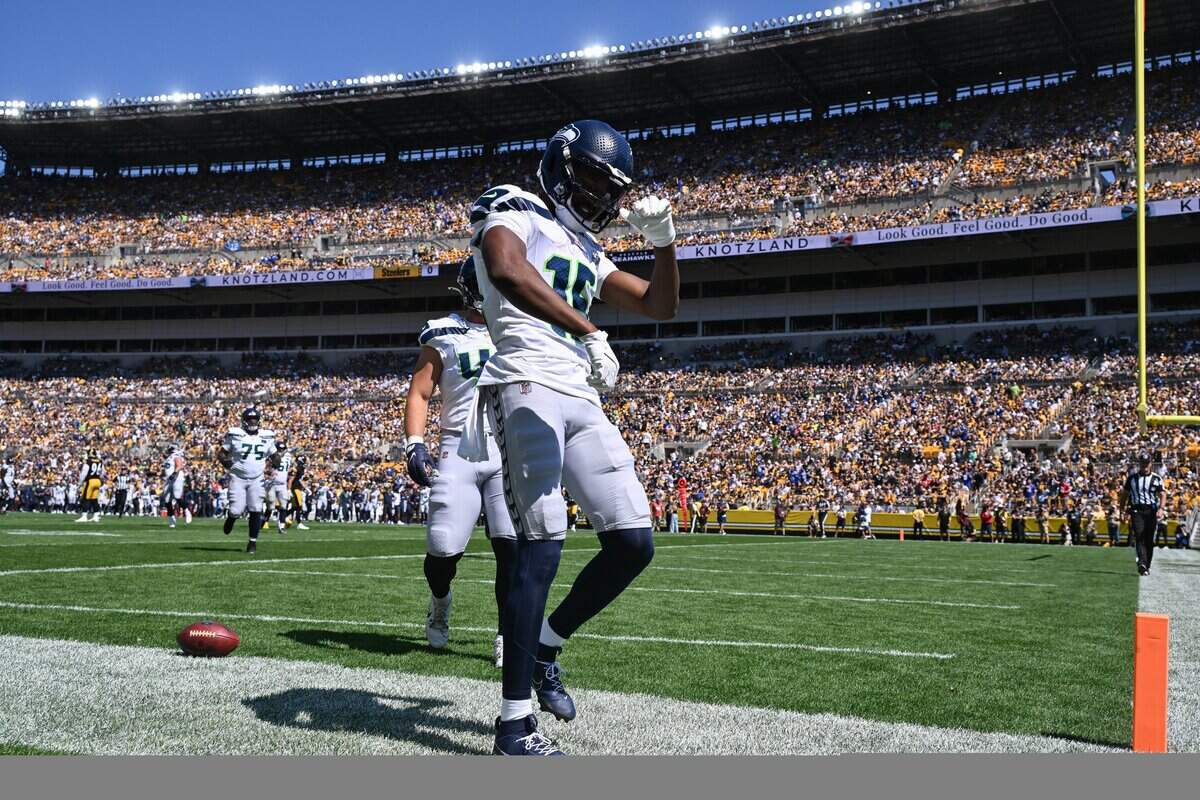 Sep 14, 2025; Pittsburgh, Pennsylvania, USA; Seattle Seahawks wide receiver Tory Horton (15) celebrates a touchdown against the Pittsburgh Steelers during the first quarter at Acrisure Stadium. Mandatory Credit: Barry Reeger-Imagn Images