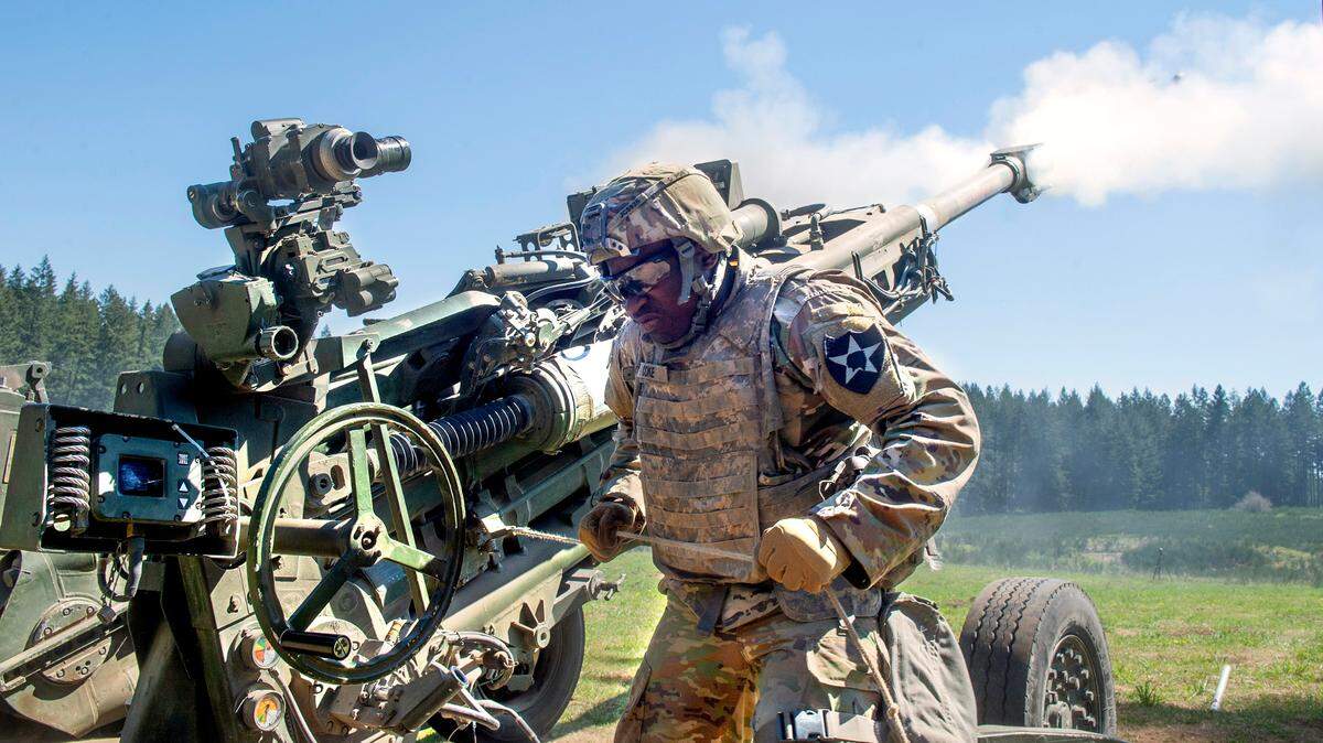 Assistant gunner Pfc. Juwuan Coke of Tampa, Florida, fires the 155-mm Howitzer cannon during training exercises at Joint Base Lewis-McChord in this 2021 file photo.