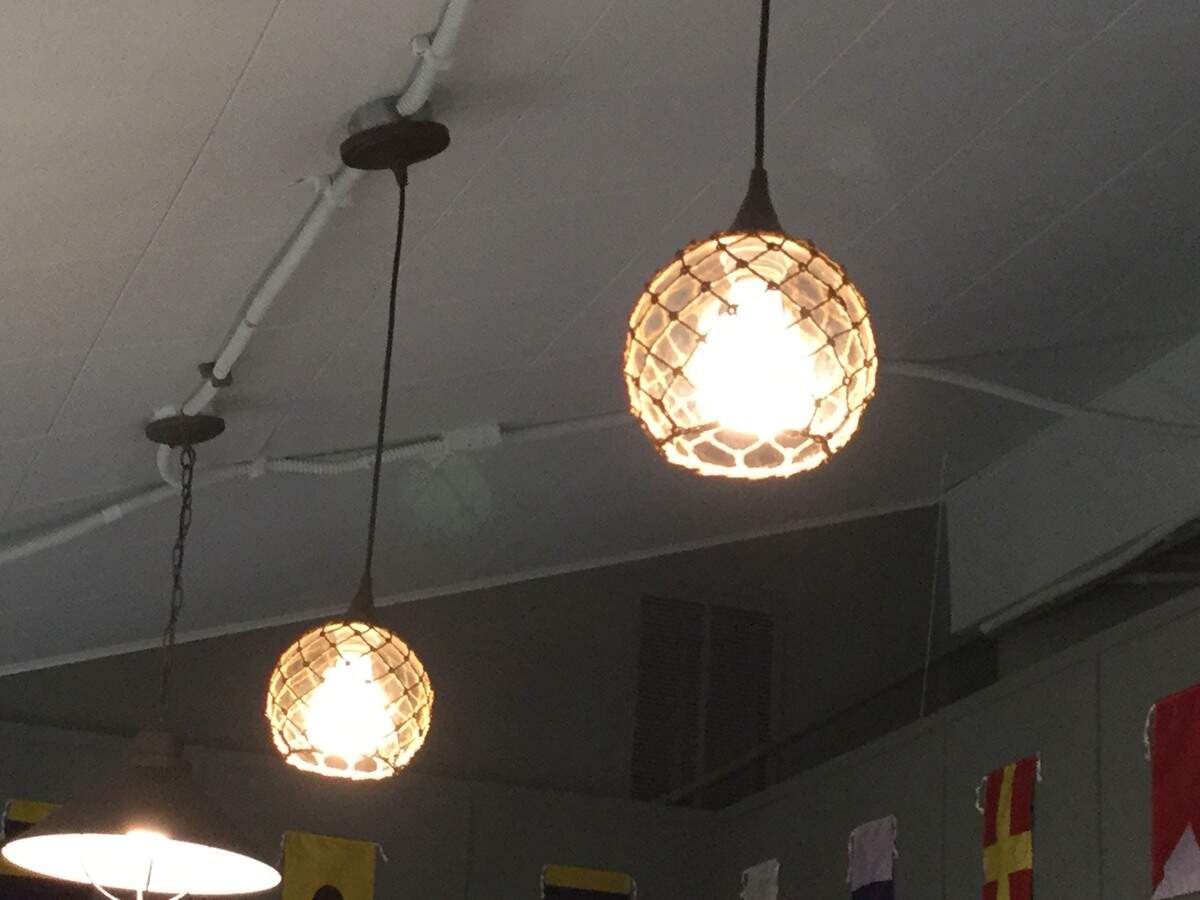 Bulb lighting surrounded by fishnet is one of many nautical-themed decorations in the newly renovated Gig Harbor Chamber of Commerce building.