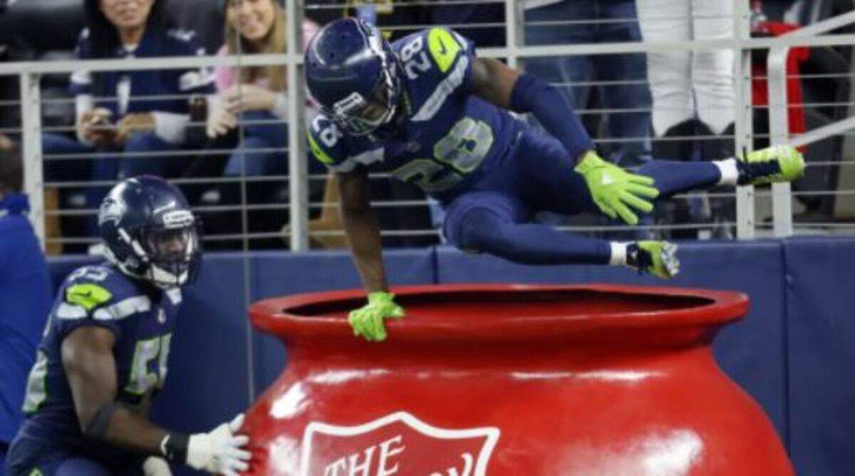 In his first stint with the Seahawks, defensive back Justin Coleman jumped into a Salvation Army donation kettle to celebrate and interception he returned for a touchdown in a win for Seattle at Dallas on Christmas Eve 2017. Coleman has re-signed with the Seahawks on a one-year contract.