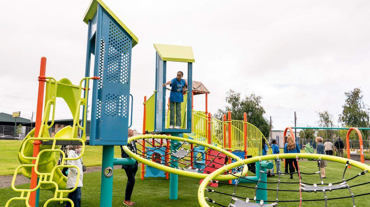 Students play in the renovated schoolyard at Whitman Elementary School on Monday, May 19, 2025.