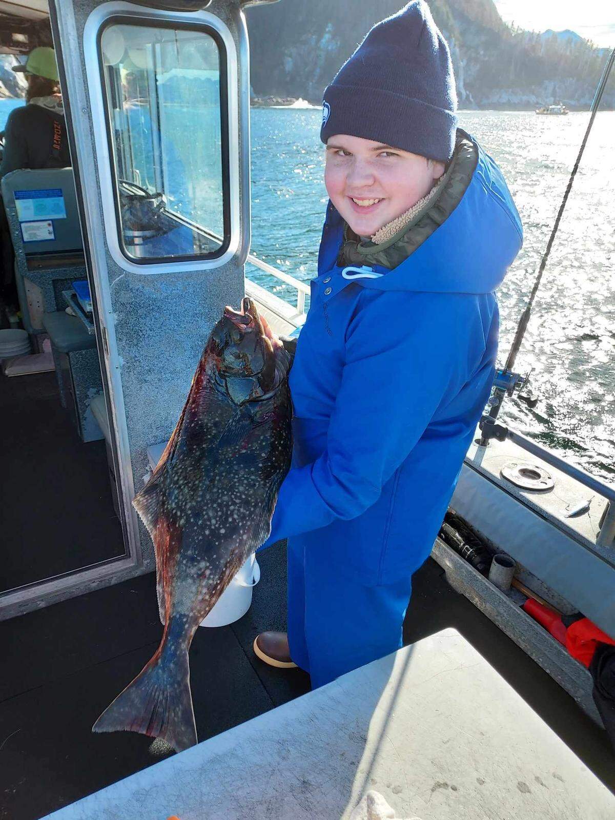 Adrian Gunter poses with a fish in Sitka, Alaska.