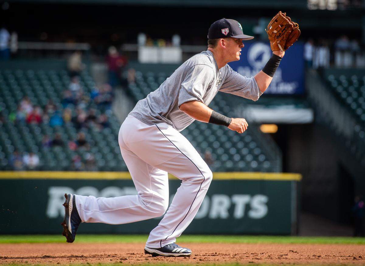 Ryon Healy takes ground balls at third base during Mariners Fan Fest at T-Mobile Park in Seattle, Wash., on Saturday, March 23, 2019.