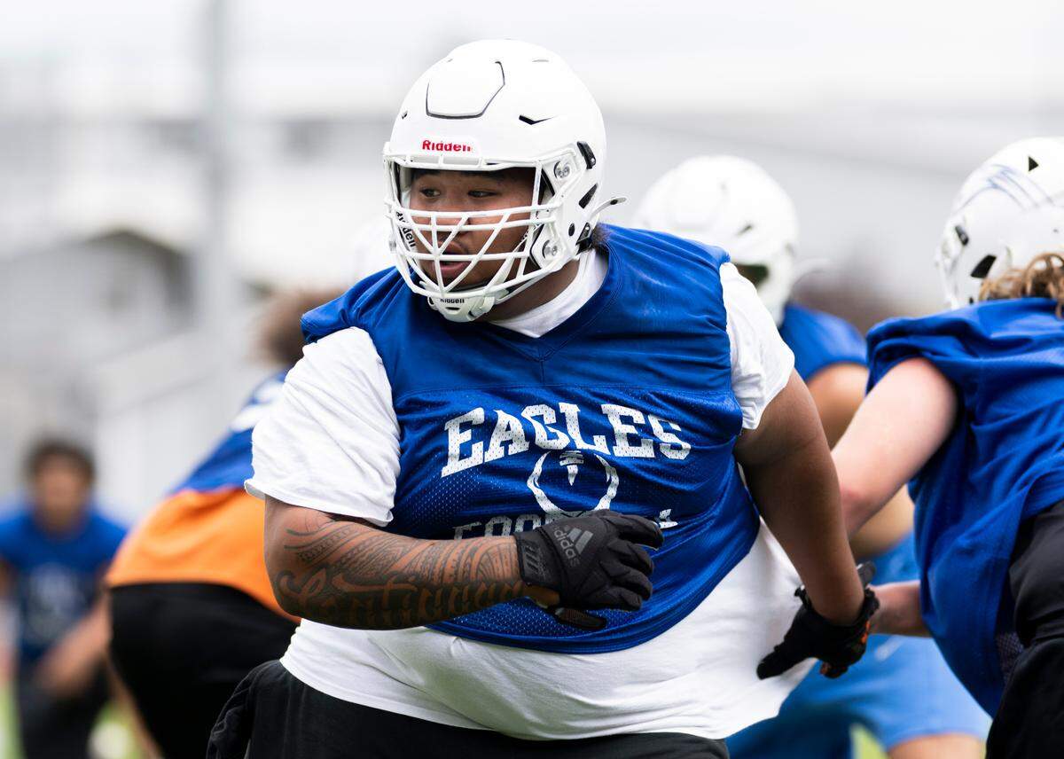 Graham-Kapowsin offensive lineman Kaleb Leatiga plays defense in a drill during a football practice at Graham-Kapowsin High School, on Thursday, Aug. 22, 2024, in Graham, Wash.