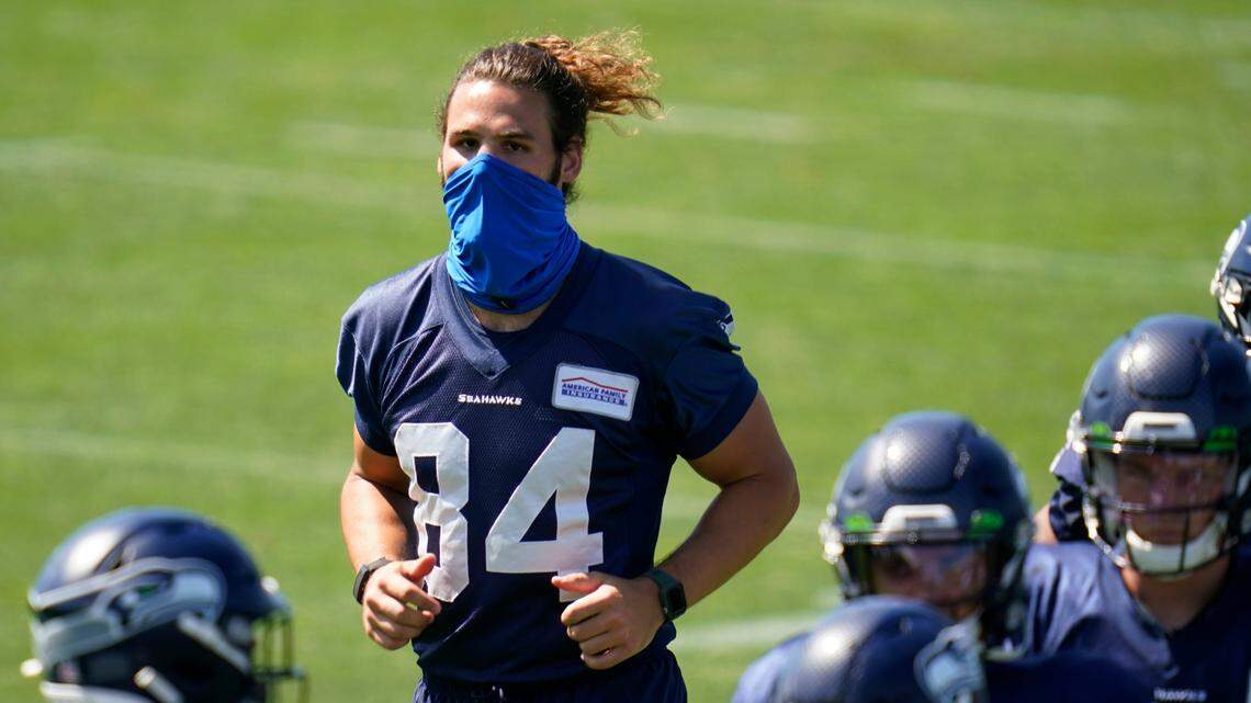 Seattle Seahawks tight end Colby Parkinson runs on the field Tuesday, Aug. 18, 2020, during NFL football training camp in Renton, Wash. (AP Photo/Elaine Thompson)