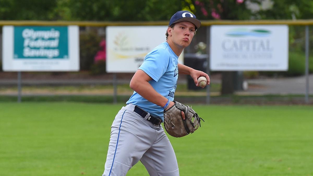 Michael Came turns to throws to first during May 20th fielding drills at Olympia High School.