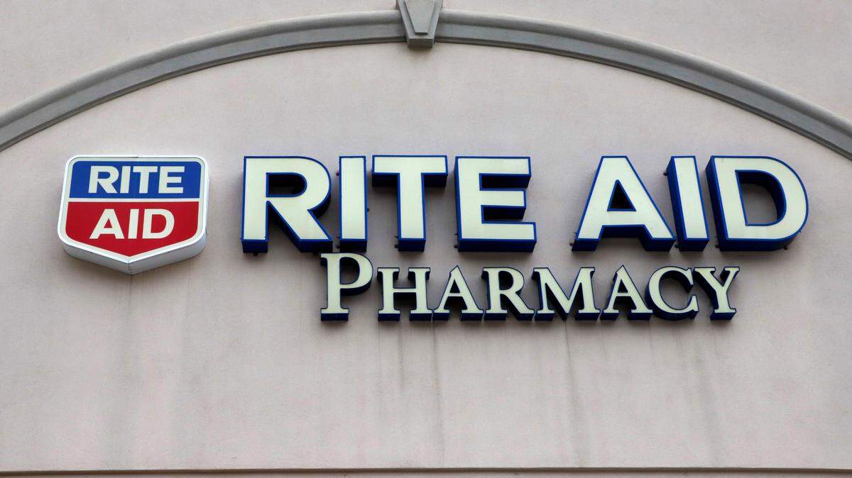 This is the sign on a Rite Aid Pharmacy in Pittsburgh, Pa., Tuesday, April 14, 2020. Rite Aid topped Wall Street expectations for the fiscal second quarter, Thursday, Sept. 24, and gave a revised annual forecast, one quarter after withdrawing it due to COVID-19 uncertainty. (AP Photo/Gene J. Puskar)