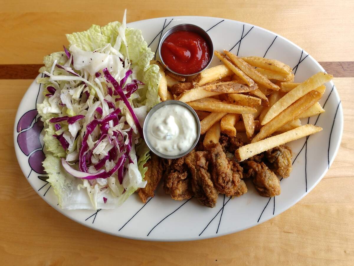 Fried oysters with fries and coleslaw from Anthony’s Restaurants.