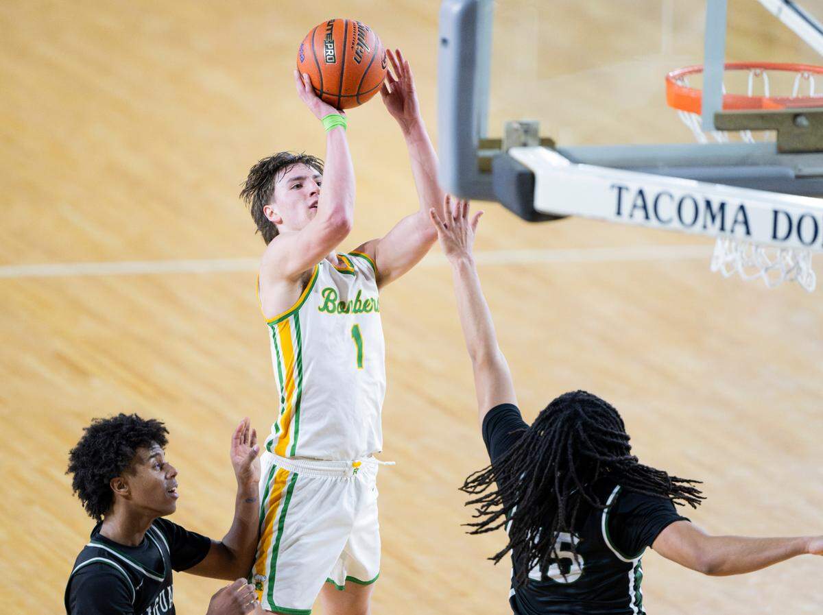 Richland’s Landon Northrop (1) shoots over Emerald Ridge’s Isaac Norris (15) during the second half of a Class 4A state basketball tournament first-round game at the Tacoma Dome on Wednesday, March 5, 2025, in Tacoma, Wash.