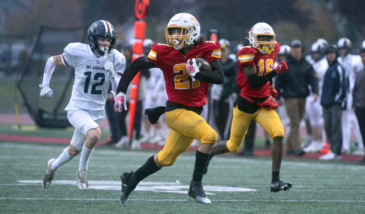 Mount Tahoma running back Tyrone Walker breaks loose in front of Mount Spokane defensive back Quincy Malacas during Saturday afternoon’s 3A playoff football game at Mount Tahoma High School in Tacoma, Washington, on Nov. 9, 2024. Malacas stripped the ball from Walker just short of the goal line, resulting in a touchback for Mount Spokane. Mount Tahoma won the game, 35-13.