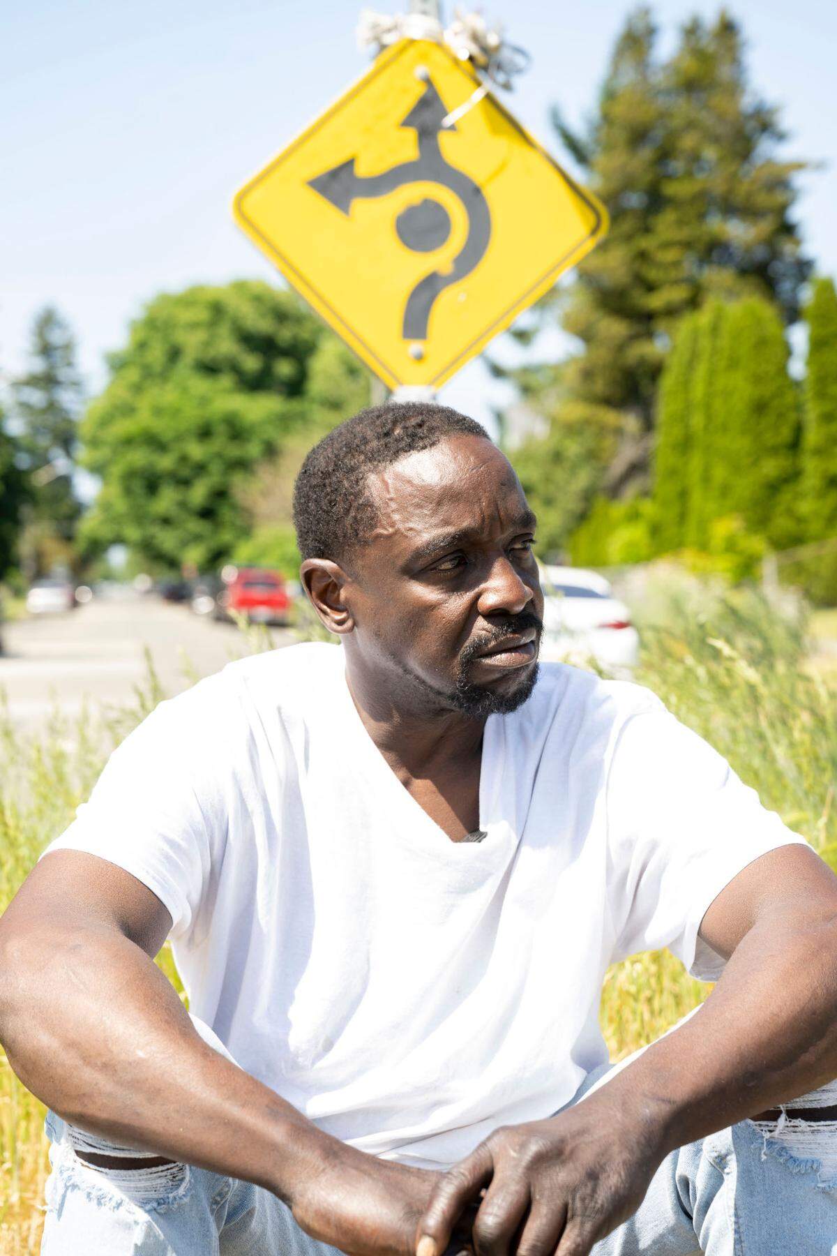 Ivory Kelly sits on a round-about outside the front of the house were he grew up and had recently been parking his RV — which was also where he was living — along South 21st Street in the Hilltop neighborhood in Tacoma, Wash., on Monday, May 29, 2023.