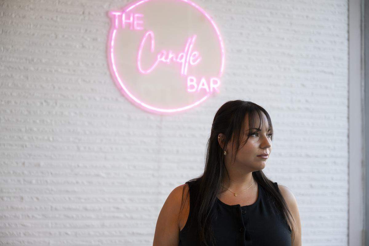 Caitlynn Mattson, co-owner of The Candle Bar, is pictured inside the shop she ran with her mother, on Tuesday, Oct. 7, 2025, in Puyallup, Wash.