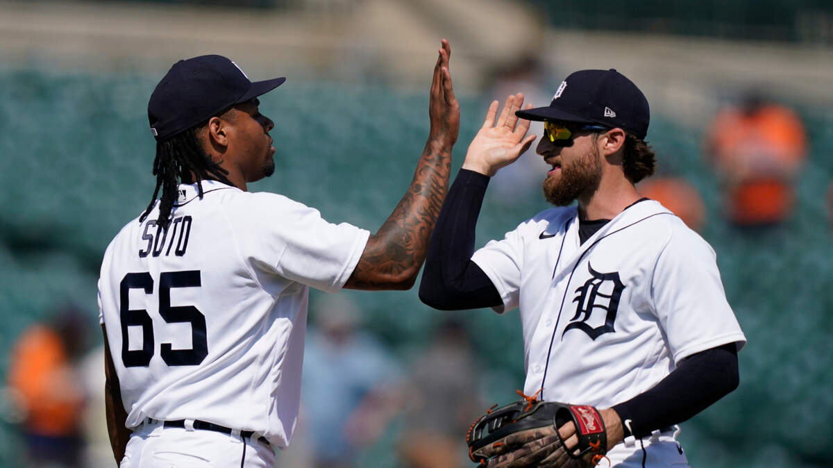Detroit Tigers relief pitcher Gregory Soto (65) greets left fielder Eric Haase after the team’s 8-3 win over the Seattle Mariners in a baseball game, Thursday, June 10, 2021, in Detroit. (AP Photo/Carlos Osorio)