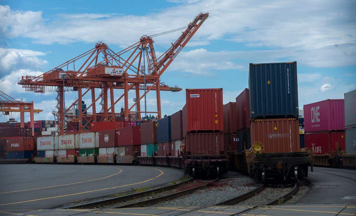 Goods are transported via shipping containers at the Washington United Terminal at the Port of Tacoma in 2021.