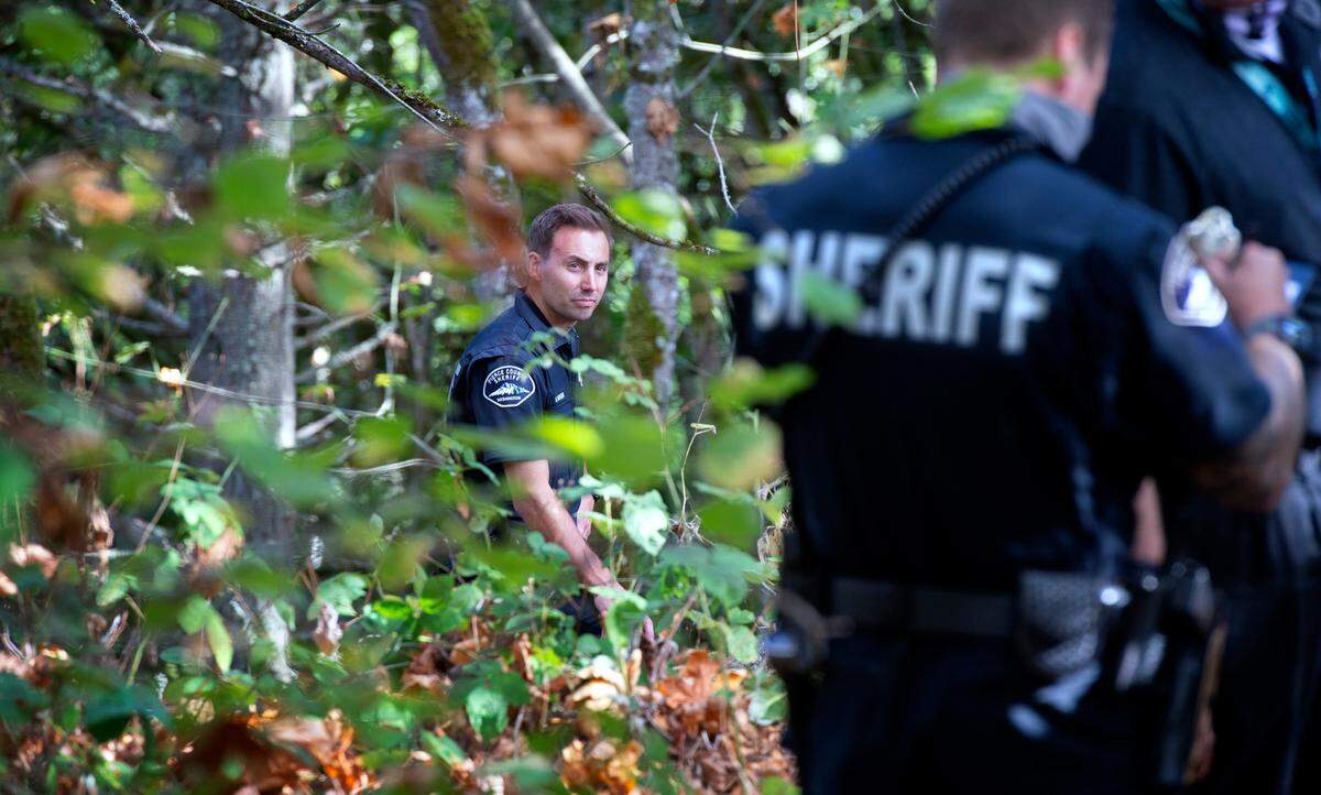 Pierce County Sheriff’s investigators gather evidence in the woods along Chambers Creek Road in University Place, Washington on Tuesday, Sept. 22, 2020. The body of Kassandra Cantrell, a 33-year-old pregnant Parkland woman who went missing Aug. 25, was found in the wooded canyon across the road from the University Place School District Transportation Department.