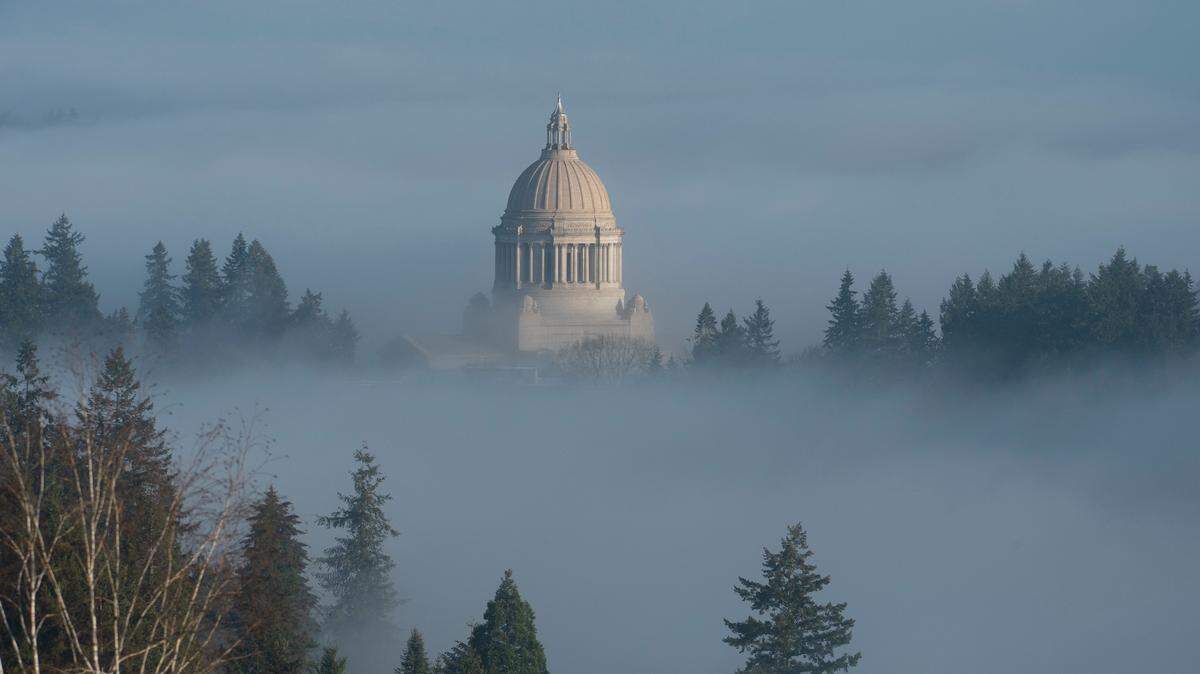 The Washington State Capitol rises from the fog in Olympia, Washington in January of this year.