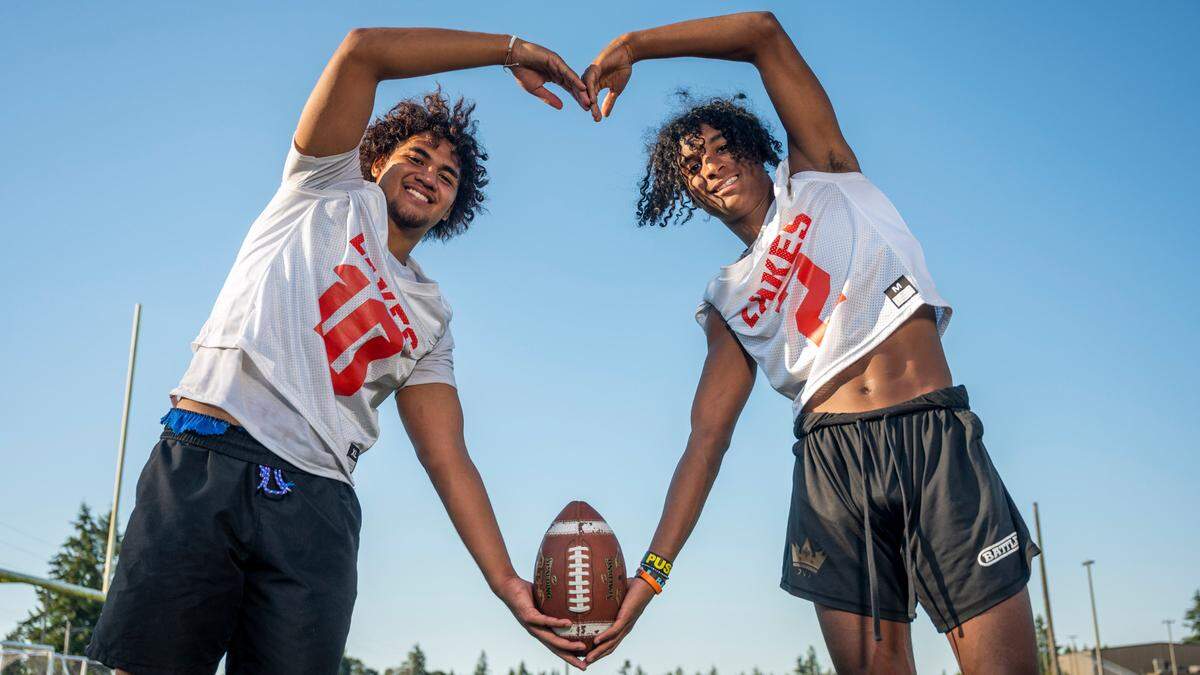 Lakes running back Leo Pulalasi (left) and receiver David Wells pose for a portrait at Lakes High School on Wednesday, Aug. 17, 2022, in Lakewood.