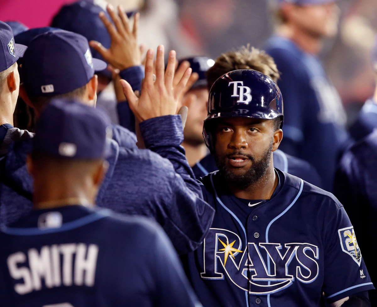 Tampa Bay Rays' Denard Span, right, gets congratulations from teammates in the dugout after hitting a two-run home run during the seventh inning of a baseball game against the Los Angeles Angels in Anaheim, Calif., Thursday, May 17, 2018. (AP Photo/Alex Gallardo)