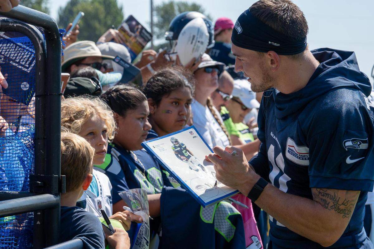 Seattle Seahawks wide receiver Cody Thompson meets with fans after practice to sign autographs and thank them for coming to the second day of training camp at the Virginia mason Athletic Center in Renton Wash. on July 28, 2022.