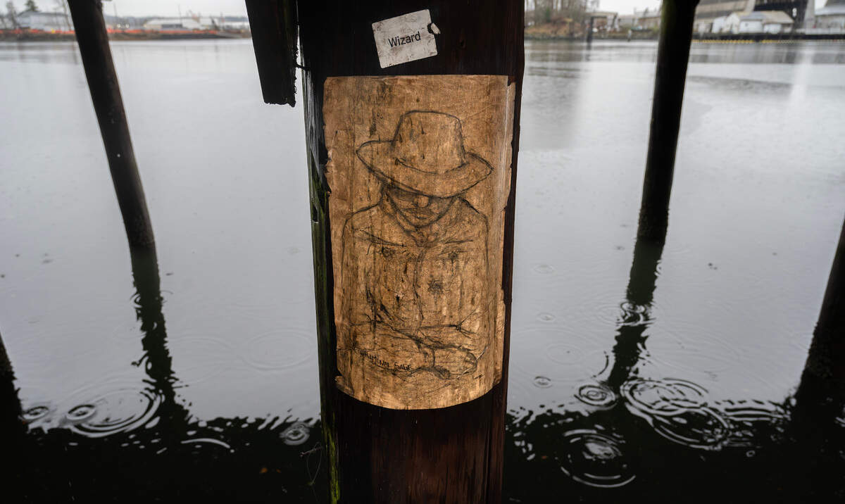 A self-portrait of street artist “Criminal Sage” is one of his favorites, he says, seen here on an old piling along the Thea Foss Waterway in Tacoma, Washington, on Tuesday, Dec. 17, 2024.