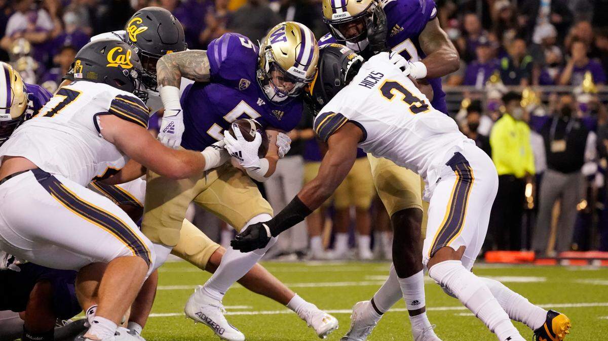 Washington’s Sean McGrew (5) scores against California in the first half of an NCAA college football game Saturday, Sept. 25, 2021, in Seattle. (AP Photo/Elaine Thompson)