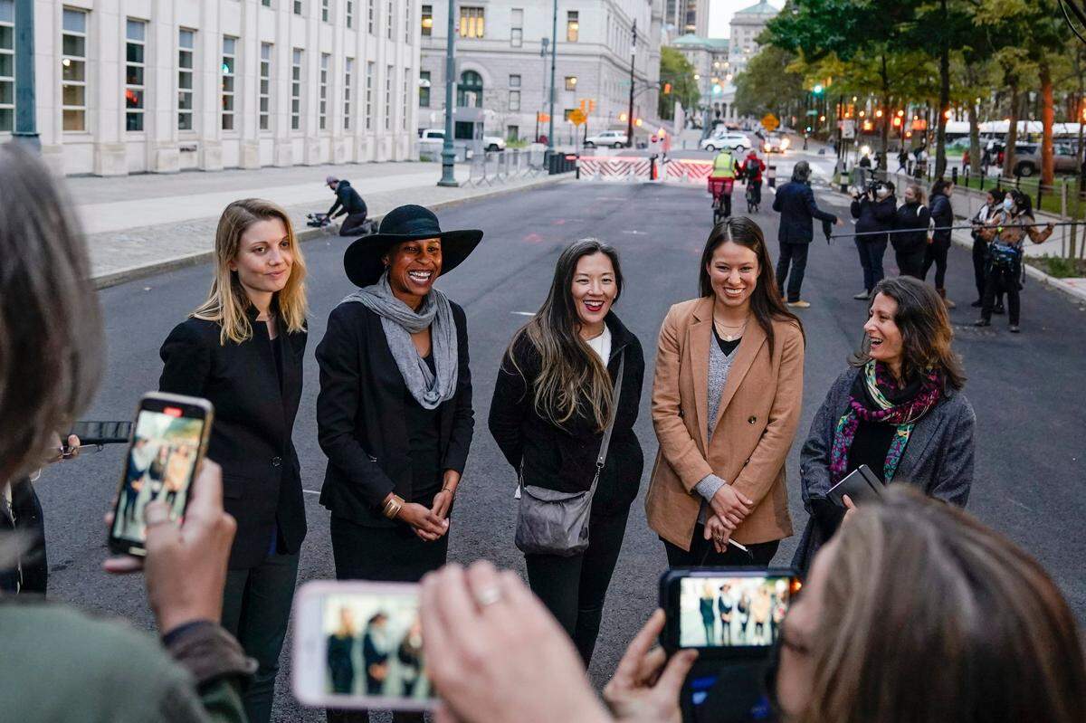 Nicki Clyne, left, Michelle Hatchette, second from left, Linda Chung, center, and Dr. Danielle Roberts, right, speak outside Brooklyn federal court following the sentencing hearing for self-improvement guru Keith Raniere Tuesday, Oct. 27, 2020, in New York. Raniere, the NXIVM leader, was sentenced to 120 years.