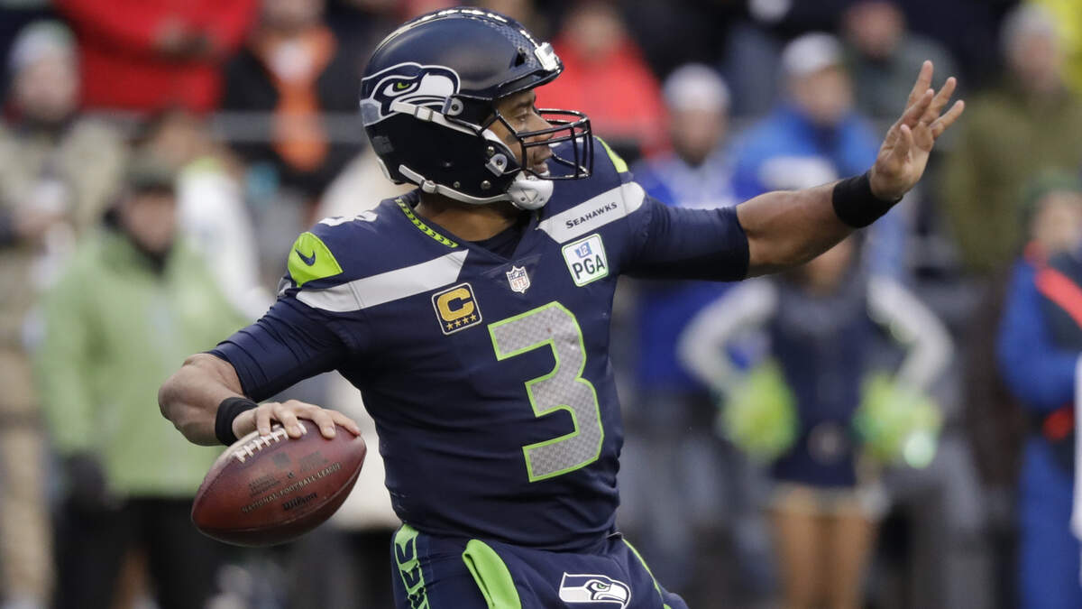 FILE - In this Dec. 2, 2018, file photo, Seattle Seahawks quarterback Russell Wilson passes against the San Francisco 49ers during the second half of an NFL football game, in Seattle. Kansas City plays at Seattle on Sunday, Dec. 23. (AP Photo/Elaine Thompson, FIle)