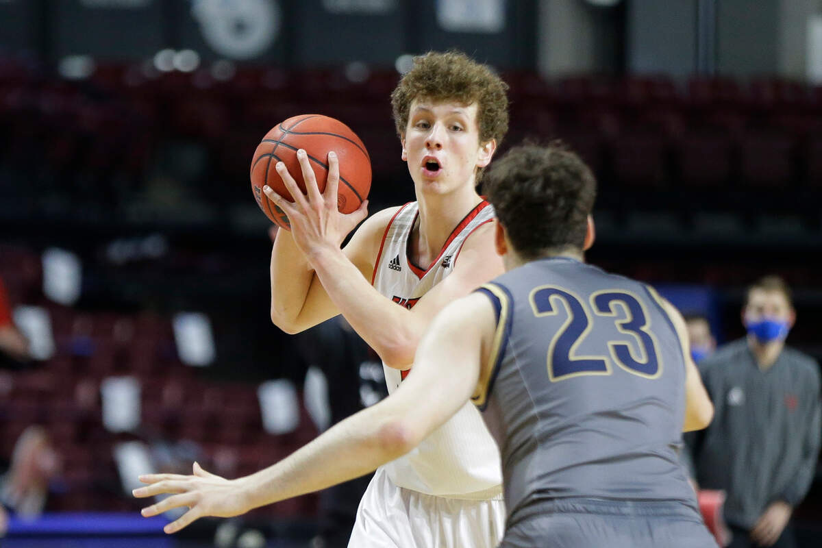 Eastern Washington guard Jacob Groves looks to pass the ball as Montana State forward Borja Fernandez (23) defends during an NCAA college basketball game for the championship of the Big Sky men’s tournament in Boise, Idaho, Saturday, March 13, 2021. Eastern Washington won 65-55. (AP Photo/Otto Kitsinger)