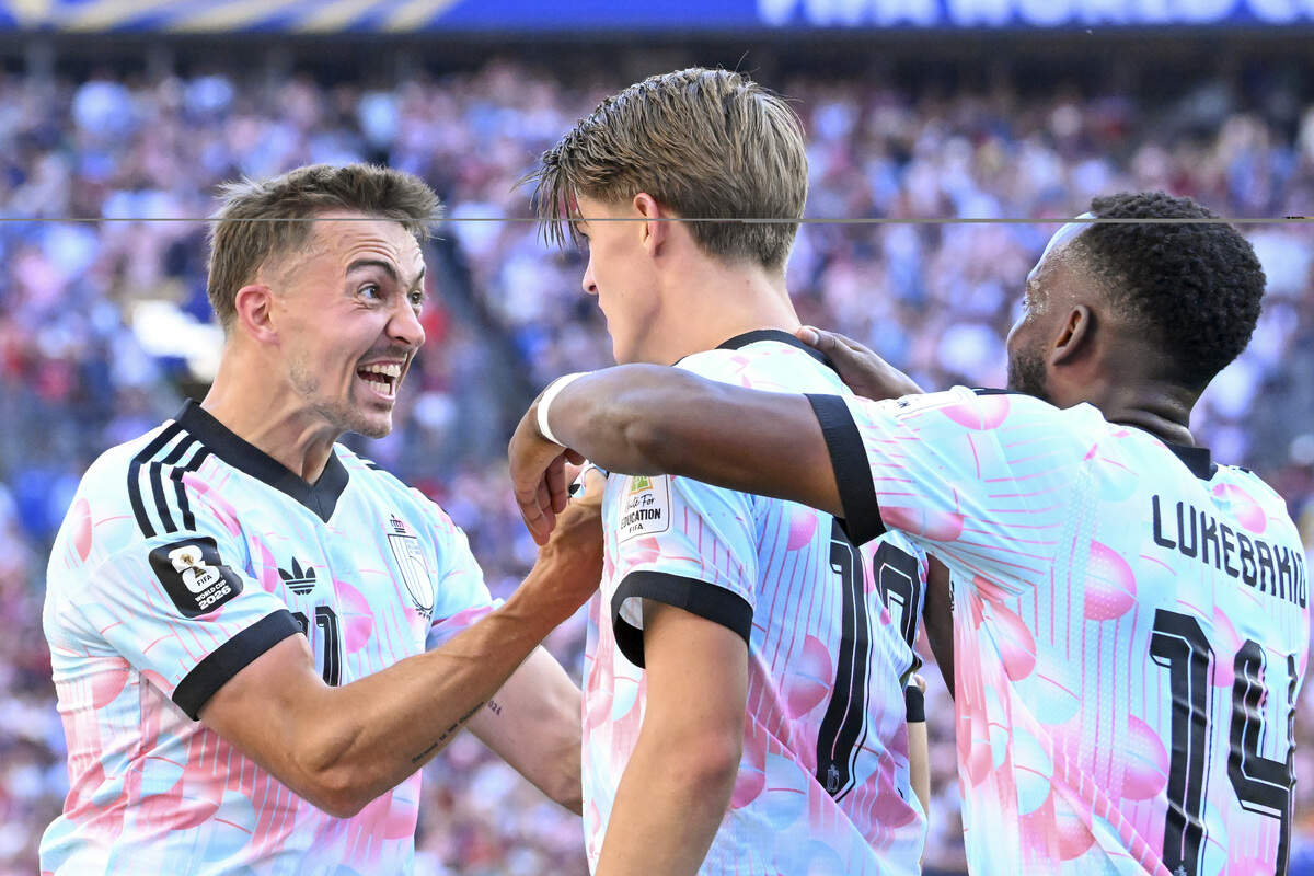 Belgium defender Timothy Castagne (21) celebrates Belgium forward Charles de Ketelaere (17) for his goal against the United States of America during a round of sixteen FIFA World Cup match on Monday, July 6, 2026, in Seattle.