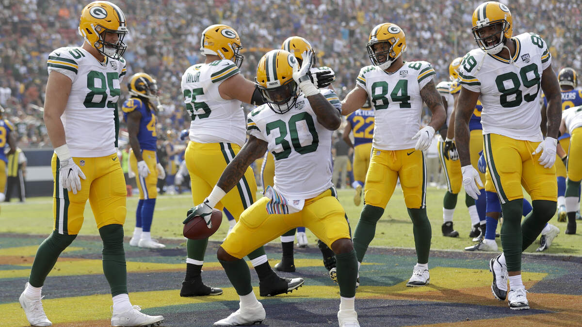 Green Bay Packers running back Jamaal Williams (30) celebrates his touchdown during the first half of an NFL football game against the Los Angeles Rams Sunday, Oct. 28, 2018, in Los Angeles. (AP Photo/Marcio Jose Sanchez)