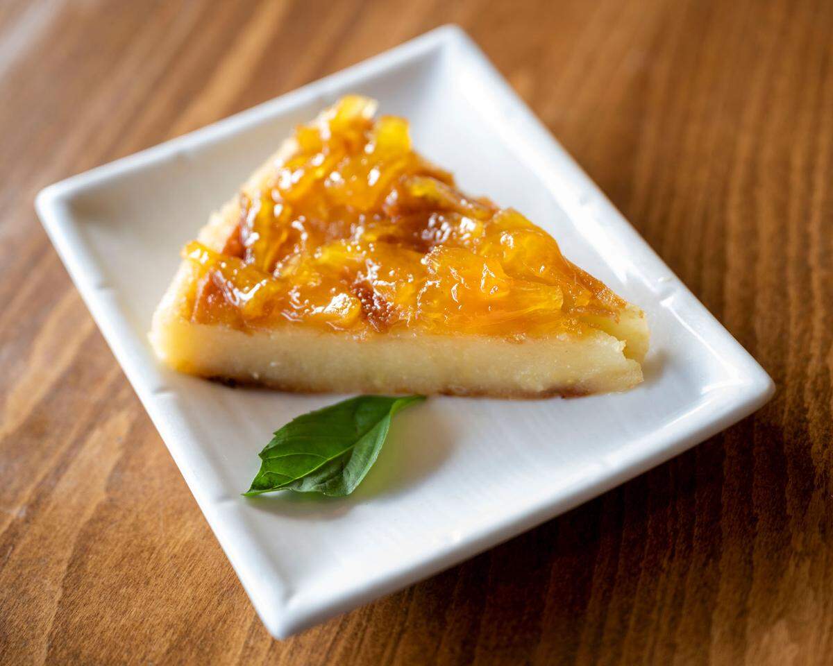 Lunar’s Pho co-owner Khanh Dang makes delicious and unexpected desserts in-house, including a banana cake with coconut cream and this cassava cake layered with candied pineapple,.