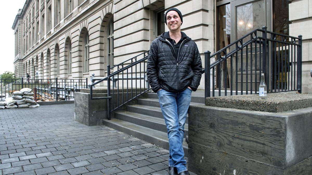 Operator Chris Keil stands outside the entrance of en Rama, located in downtown Tacoma at Courthouse Square, known locally as the Old Post Office building. Keil told The News Tribune that the bar and restaurant will soon require proof of vaccination for those who wish to dine inside. Photo taken in Tacoma on Tuesday, March 21, 2017.