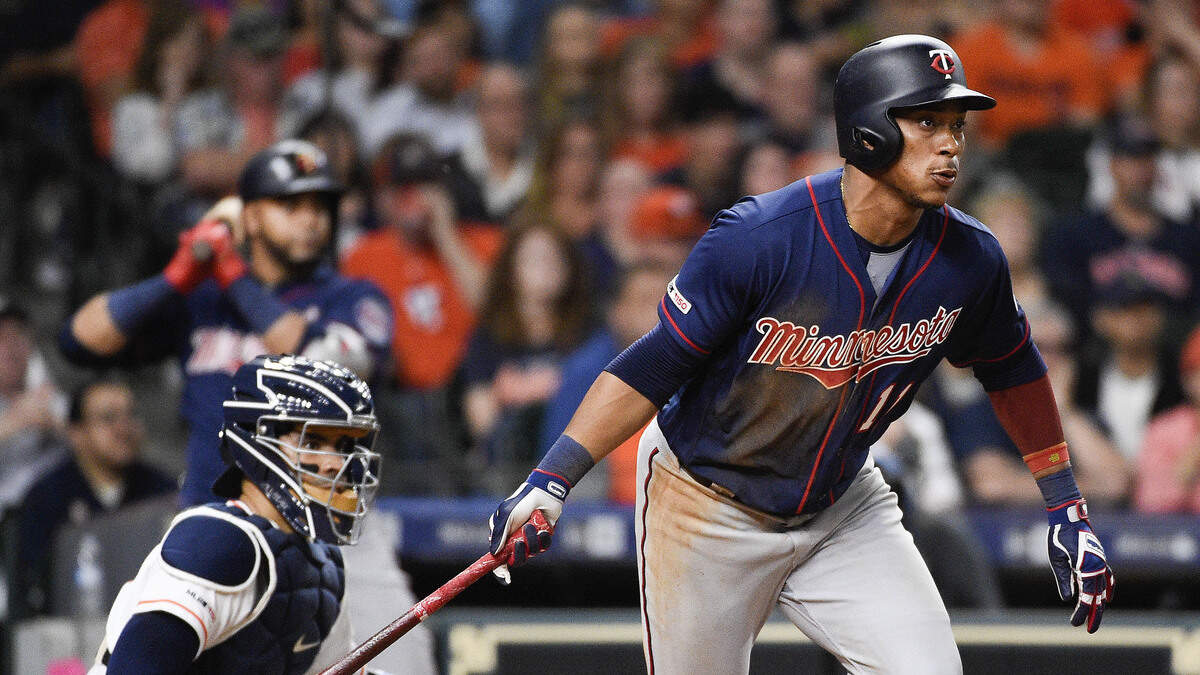 Minnesota Twins’ Jorge Polanco, right, starts to run after hitting a two-run single during the sixth inning of a baseball game against the Houston Astros, Monday, April 22, 2019, in Houston.