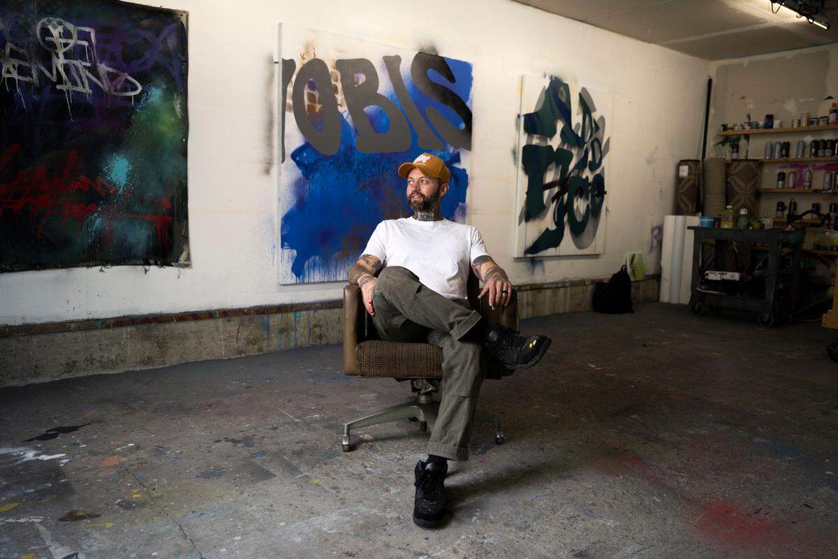 Typograffic abstraction artist Jared Michael Haviland pose for a photo in his home studio, on Monday, May 6, 2024, in Tacoma.