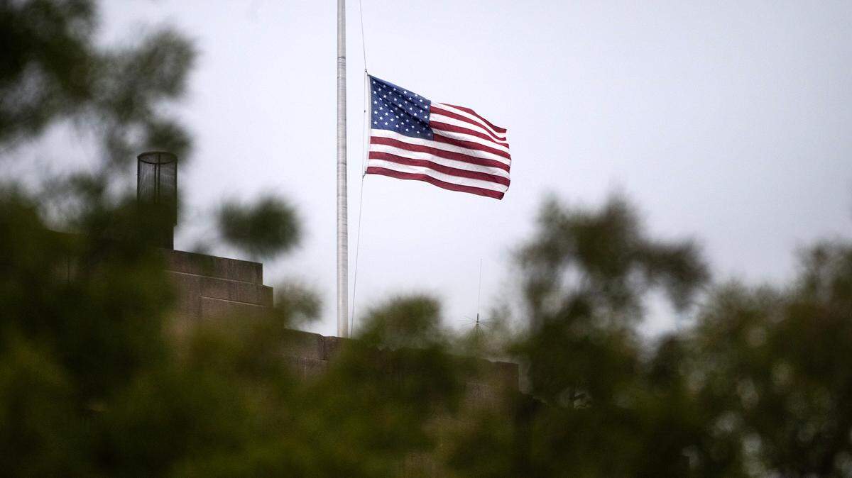 The American flag flies at half staff atop the Tacoma City Hall building in Tacoma, Washington, on Tuesday, July 30, 2024.
