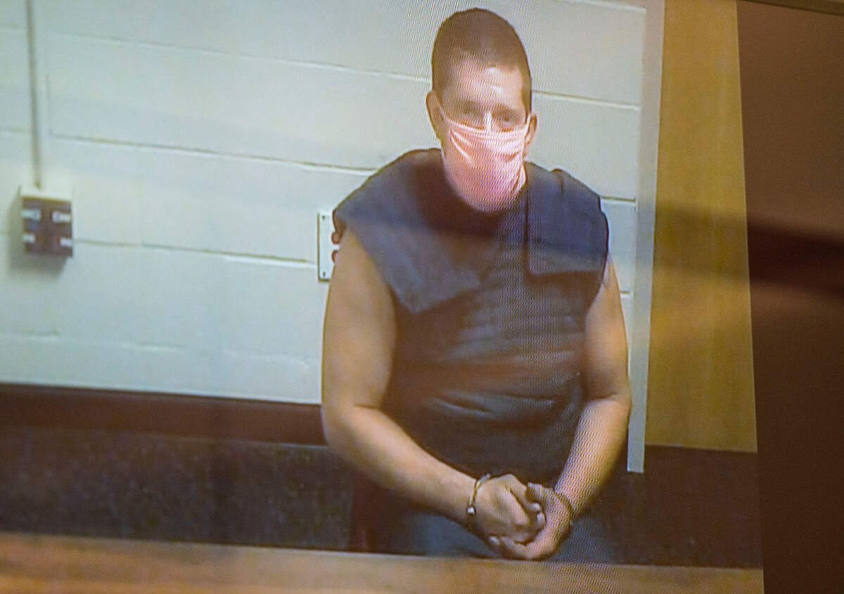 Briand Widland, 35, appears in court for his arraignment after being charged in June with manslaughter for a shooting at his Puyallup home where his daughter picked up one of his rifles and shot her 2-year-old cousin thinking the gun was fake, according to court documents, at the Pierce County Superior Court in Tacoma, Wash. on Tuesday, August 9, 2022.