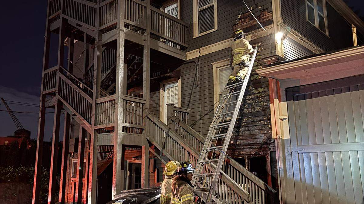 Crews fight a fire at an apartment in the 200 block of North Yakima Ave in Tacoma, Wash. on the morning of May 27, 2026.