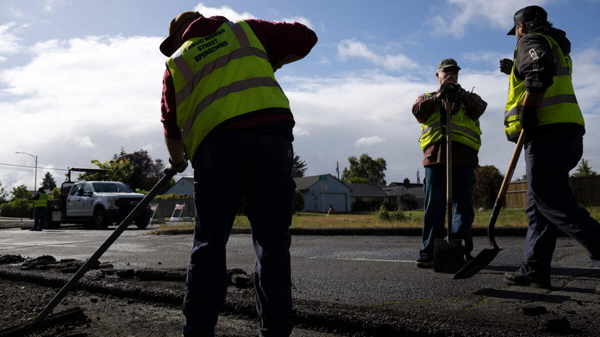 A Tacoma Public Works crew works to replace asphalt along North 21st Street , on Monday, June 3, 2024, in Tacoma.